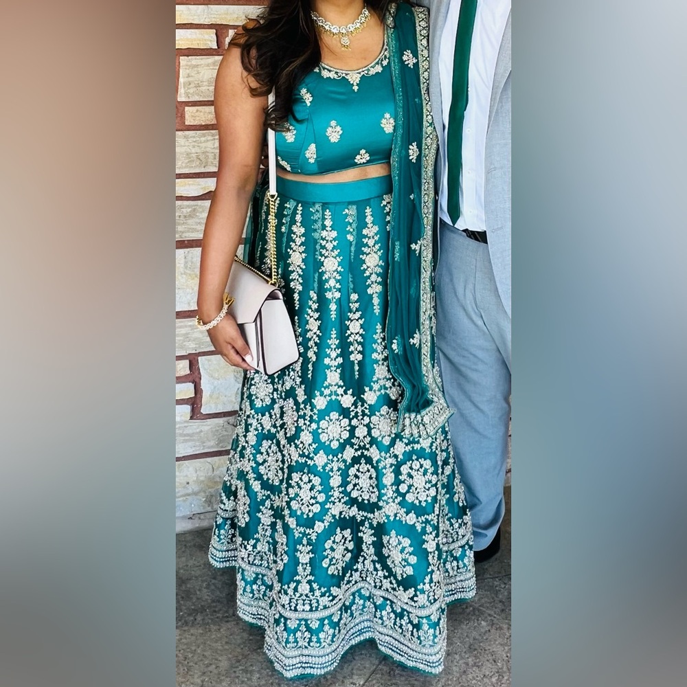 Green/teal lehenga with gold thread & stone work